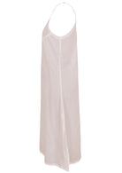 White cotton voile slip dress with adjustable spaghetti straps, V-neckline, side splits and a picot trim hem, side view