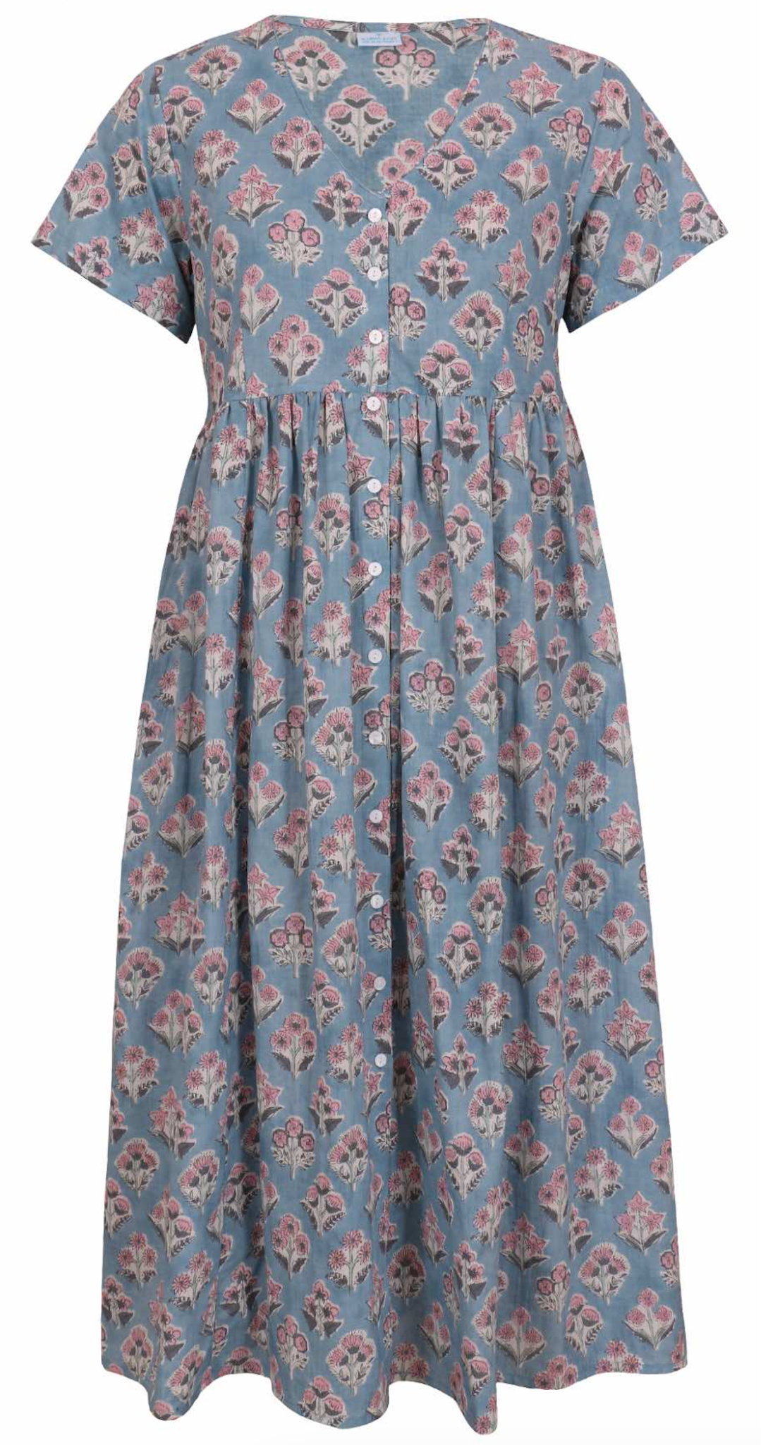 Woman standing in a 100% cotton floral print dress with a V-neckline, short sleeves, pockets, and buttons through to the knee.