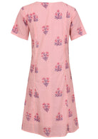 Back view of cotton dress with round neckline in pink striped white based floral print. 