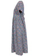 Side view of powder blue based floral print V-neck cotton dress with pockets.