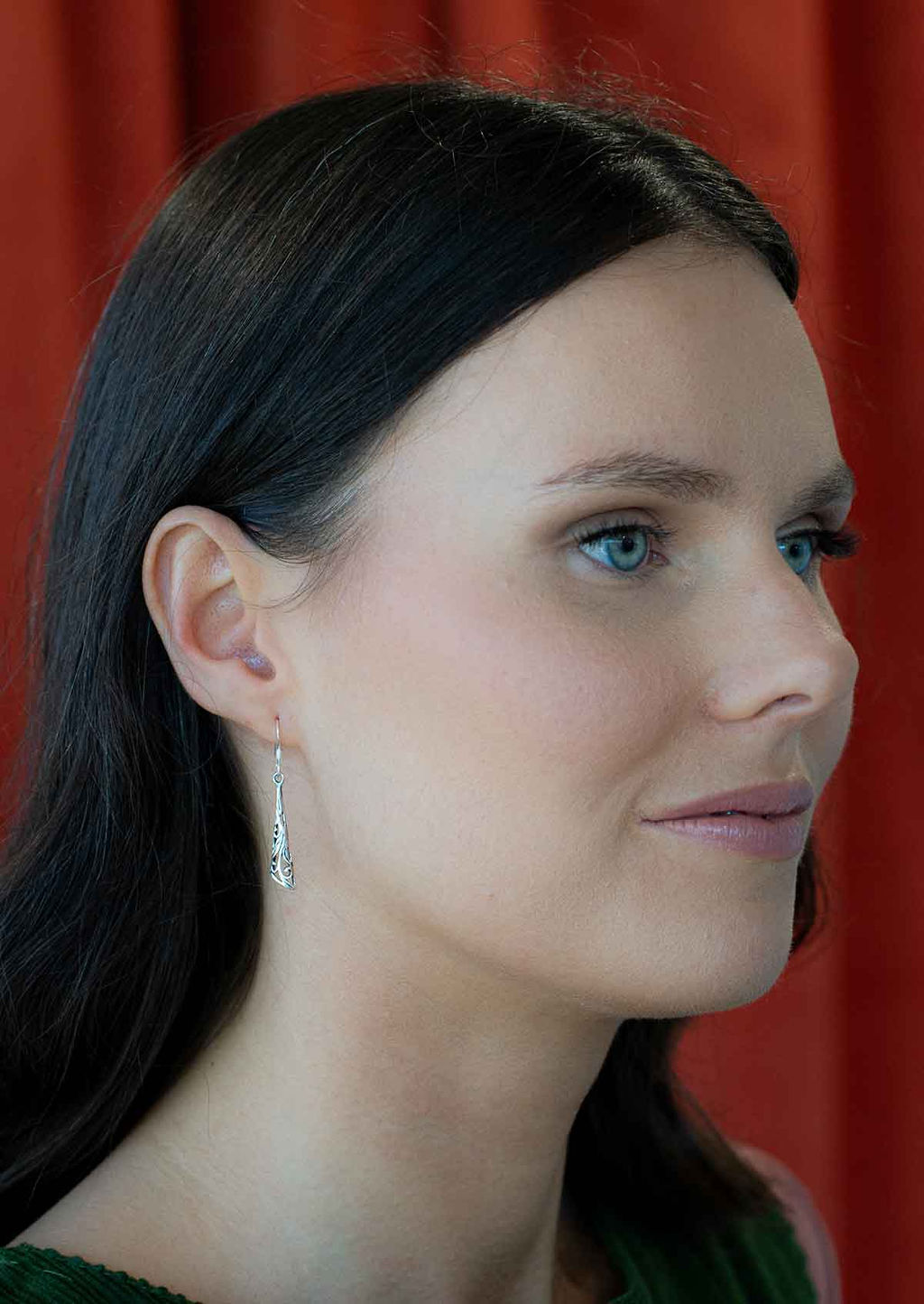 woman wearing silver filigree drop earring 92.5 sterling silver 