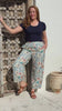 Greta Pants Keepsake video of printed cotton pants on model with red hair in front of wooden door