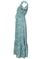 Side view of 100% cotton maxi dress in aqua blue based floral print.