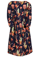Back view of knee length cotton dress with gathers at waistband and 3/4 sleeves.